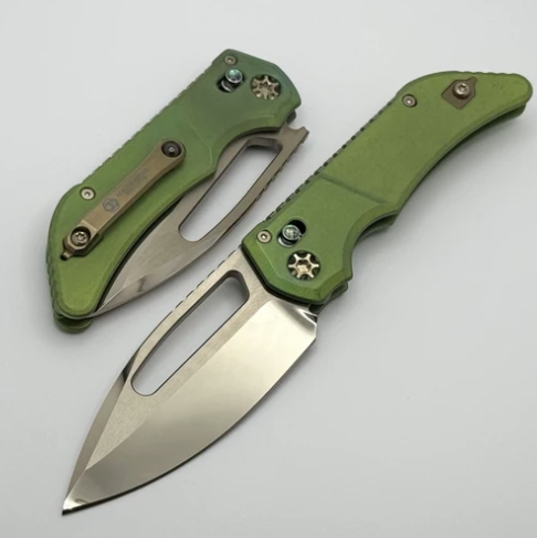 Heretic Knives Custom Koschei , Hand Ground Bronze Cracked Ice M390 Blade, Antique Green Titanium Chassis With Abalone Button Inlay And Bronze HW